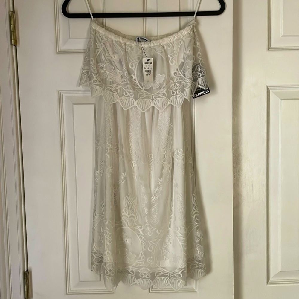 Express mini dress. Slight peek a boo back. New with tags.
